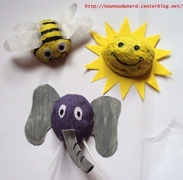 Soleil,éléphant, abeille réalisés avec des coquilles de noix